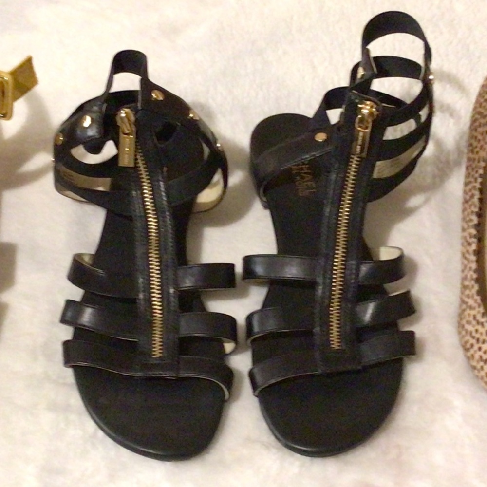 Michael Kors flat slide foot in hightop leather sandals with zipper detail.